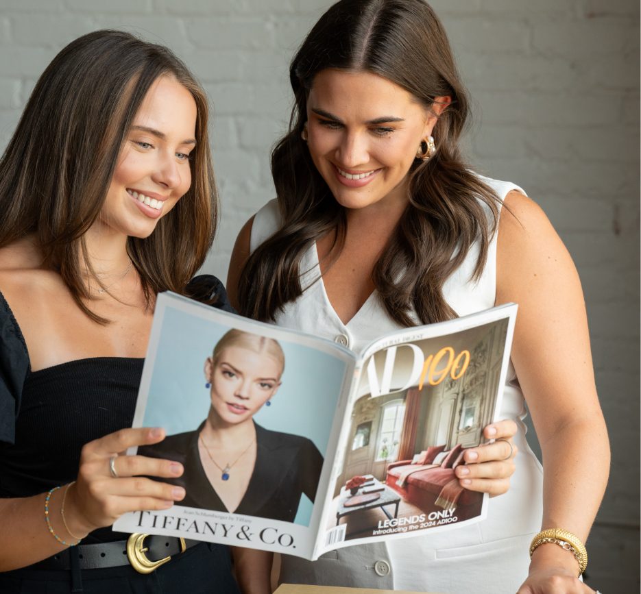 Charlotte PR Professionals looking at a magazine feature